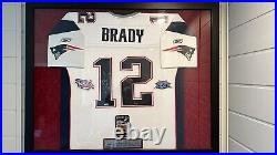 Framed Autographed Authentic Tom Brady Reebok Jersey